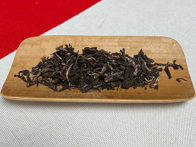 图为私藏茶红印2016薄荷塘357克饼